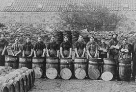 Gutting "Quines" and cooper "loons" packing herring at a Peterhead curing yard, late 1800s