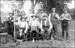 George Wilson, standing second from right, with his farm hands